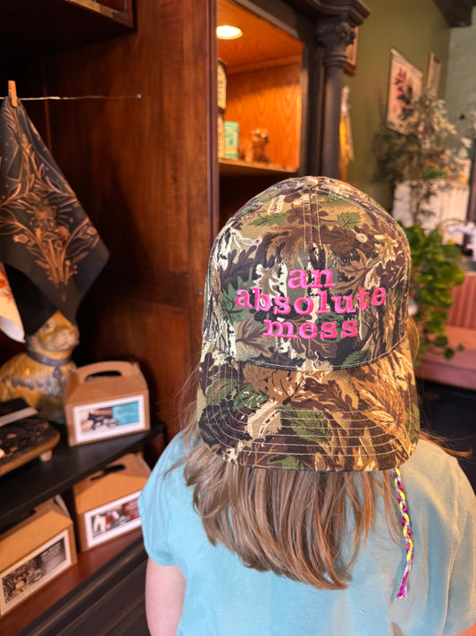 an absolute mess Trucker Hat